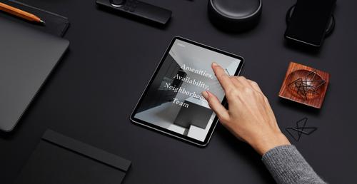 Desk objects and iPad displaying website built with Squarespace Enterprise